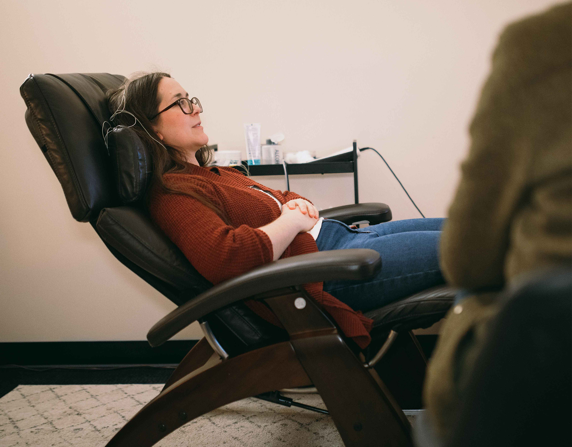 Woman receiving biofeedback.