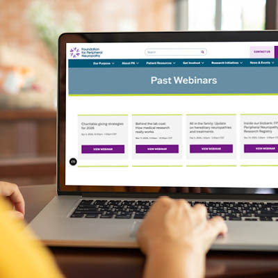 Person using a laptop displaying a webpage titled “Past Webinars” from the Foundation for Peripheral Neuropathy.